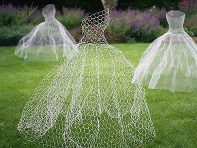 There are three ghost dresses made of chicken wire.