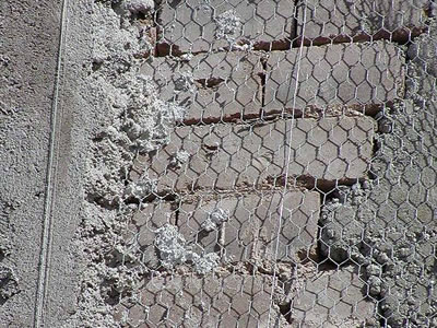 Galvanized light hexagonal wire mesh is fixed on wall by plaster which.
