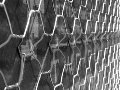 Galvanized stucco netting is fixed on the wall.