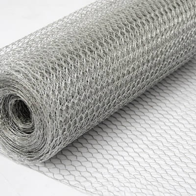 A roll of galvanized hexagonal wire mesh on the white background.