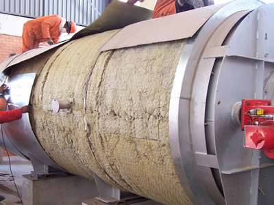 A tank is half wrapped by jacket, the left half remains in rock wool blanket.