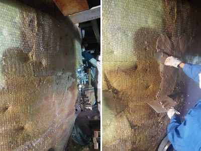 A worker is plastering over the surface of hexagonal wire mesh wrapped rock wool blanket.