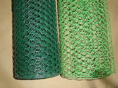 There are dark green and light green PVC coated hexagonal wire mesh rolls.