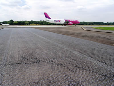 Hexagonal wire mesh is applied on a aeroplane field.