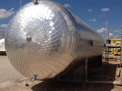 Metal jacket is applied over the big tank after rock wool.