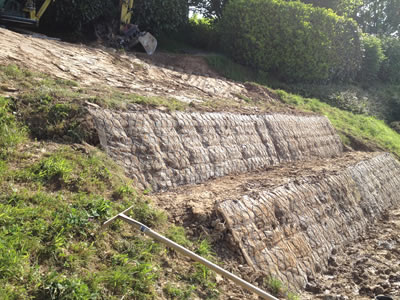 Two inclined green terrameshes have been fixed onto a rather small slope.